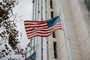 American flag flying in front of government building